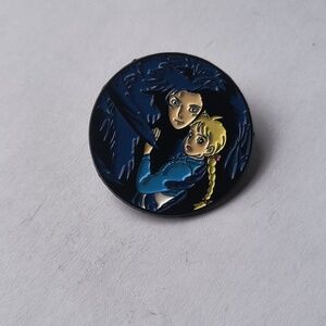 Round Anime Enamel Pin Featuring Two Characters in Navy & Yellow